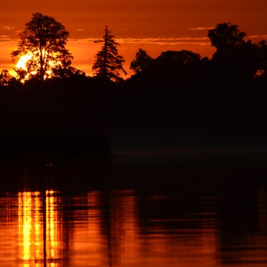 Solnedgang over søen Romsø